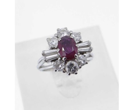 the central ruby (6 x 5mms approx.) surrounded by six round and four tapering baguette cut diamonds (1.1cts total approx.), r
