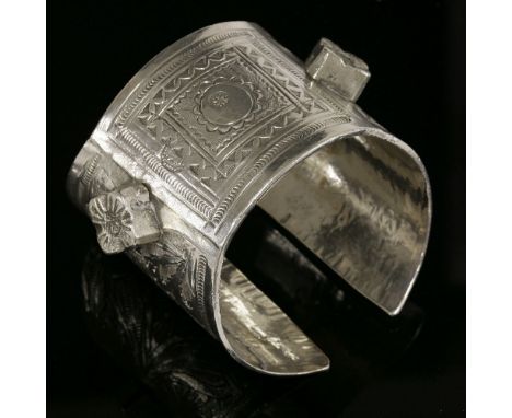 A collection of ethnic jewellery,to include:a tapering silver cuff bangle with engraved and wriggle decoration and applied cu
