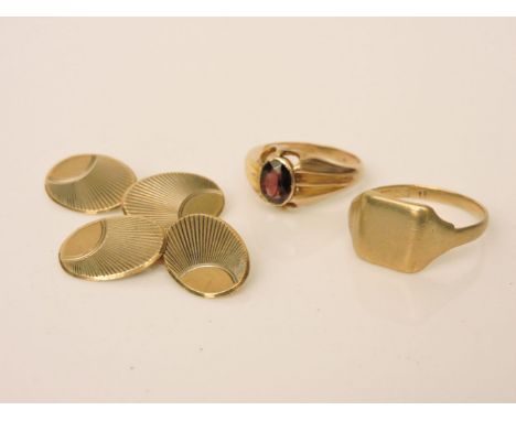 A 9ct gold gentleman's single stone garnet ring, a 9ct gold signet ring, and a pair of gold cufflinks, marked 9ct