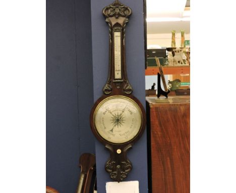 R.Angelinetta, London;A 19th century carved rosewood banjo barometer,103cm high