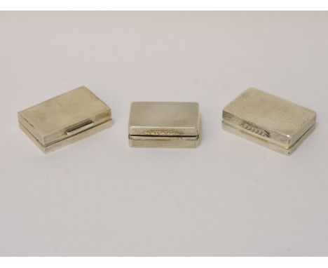 Three silver engine turned pill boxes