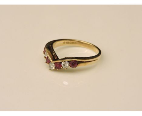 A 9ct gold diamond and ruby wishbone ring, size K, 2.3g