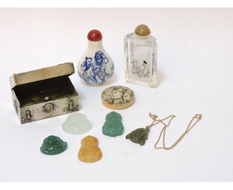 Two Chinese snuff bottles, a disc decorated with a Manchurian, five Buddha pendants, and a French 19th century silver plated 