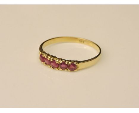 An 18ct gold five stone ruby ring, size P½, 1.9g