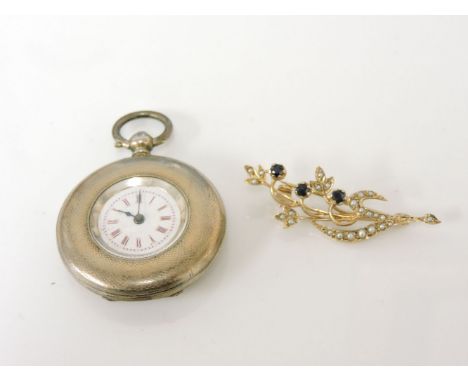 A continental silver half hunter fob watch, with engine turned decoration and Arabic numerals, and a 9ct gold sapphire and sp