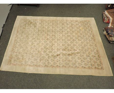 An ivory ground carpet, 298cm x 222cm