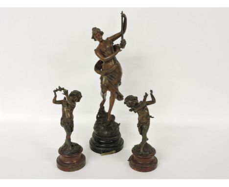 A bronzed figure of a young maiden with harp, a reproduction of Melodie by Par Ruttony and two further bronzed figures of che