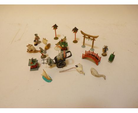 A collection of small painted cast metal Japanese figures, tallest, 4.5cm high, a large 18th century horn ladle, 41cm long, a