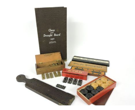 A set of brass dominoes, cribbage boards, advertising domino sets