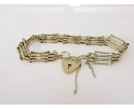 A 9ct gold four bar gate bracelet, with padlock, 10.1g