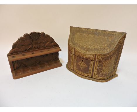 A tooled leather stationery box, 23cm high, a carved Asian pipe rack, a Swedish glass table ornament, reverse cut, signed, 12