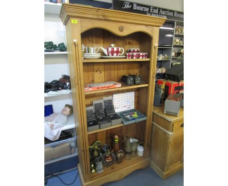 A modern pine bookcase on bracket plinth 66"h x 35"w 