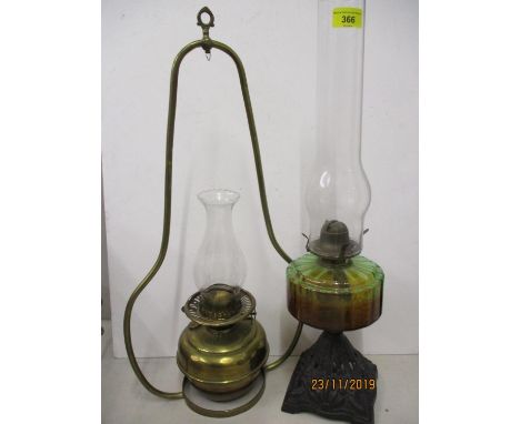 A Victorian brass hanging oil lamp (shade deficient), together with a Victorian oil lamp to include two glass funnels 