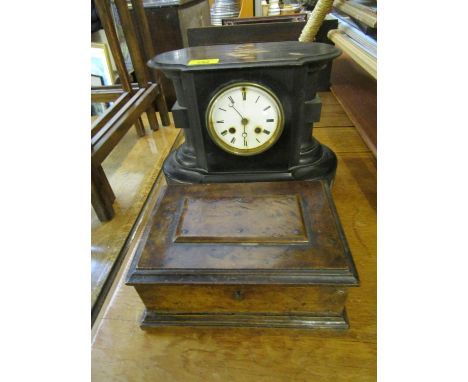 A Victorian ebonized mantel clock with white enamelled Roman dial with twin winding holes, and moon handles, housing a Japy F