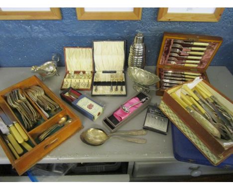 A quantity of silver plated cutlery and other items to include a walnut cased 19th century knife and fork set with carved ivo