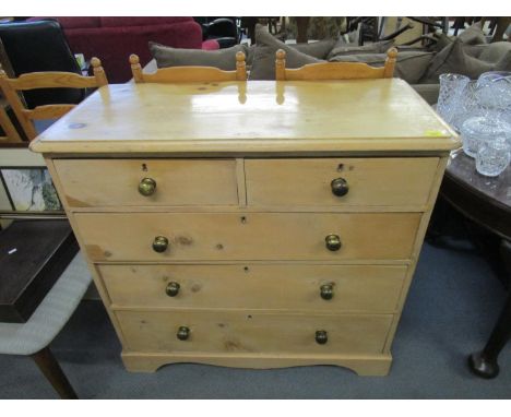 An early 20th century pine chest of five drawers raised on bracket feet 36"h x 39"w 