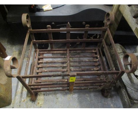 An early 20th century cast iron fire grate 