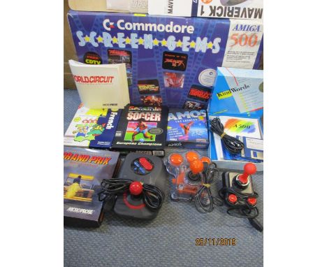 A Commodore Amiga 500 console, together with games, controllers and manuels 