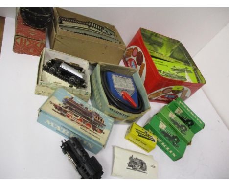 A Marklin engine in original box, together with a Marklin transformer, track and boxed carriages 