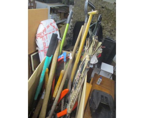 A selection of garden tools, together with an umbrella 