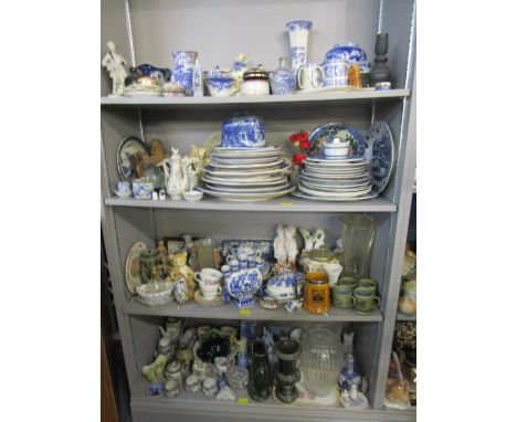 Four shelves of mixed ceramics and glassware to include various blue and white china, porcelain figures, Delft tile wall plaq