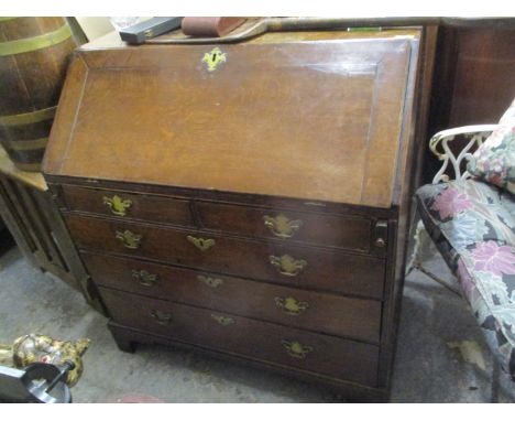 A George III oak bureau with two short and three long drawers, on bracket feet, 39"h x 36"w 