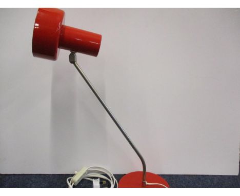 An East German red and chrome desk lamp with an adjustable head 