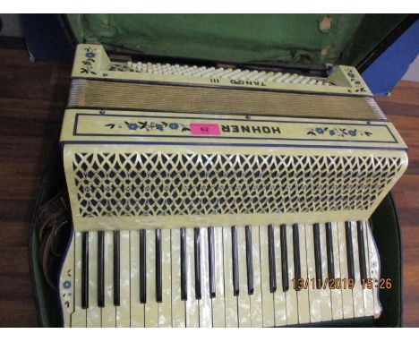 A Honer Tango III piano accordion with a mother of pearl effect case 
