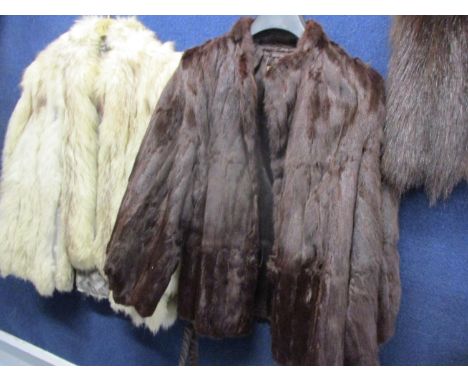 A mid 20th century Colman and Sumberg brown ermine jacket with bell sleeves and pom pom style button, 24" long x 40" chest, a