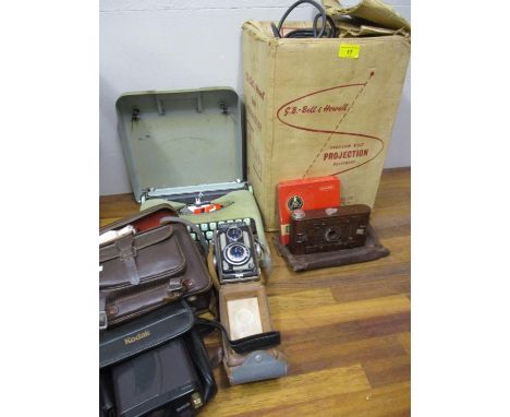 A vintage Hermes baby typewriter, a Yashica 44 camera and other camera equipment 