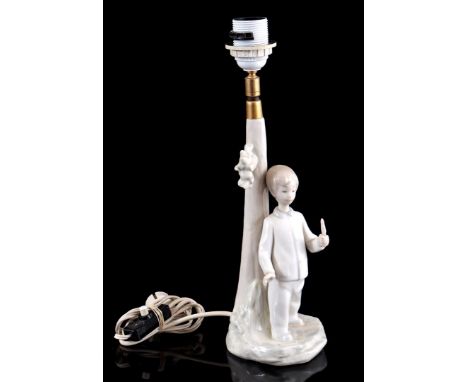 Porcelain lamp with decor of a boy near a tree, 40 cm high (damaged)