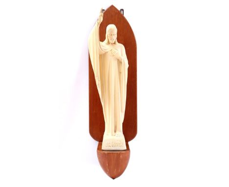 Plaster Christ statue, design Wim Harzing Rysenburg Holland, with text Jubedomine benedicere, statue 69 cm high, on oak wall 