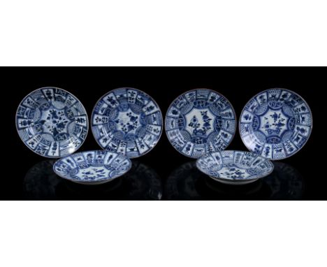 6 porcelain dishes with blue and white floral decor in the heart and various symbols such as swastikas and urns in the rim, C