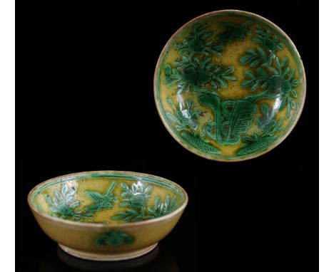 Porcelain 'longevity' dish with yellow and green enamel decoration of peach tree with six peaches and bird, unglazed bottom, 