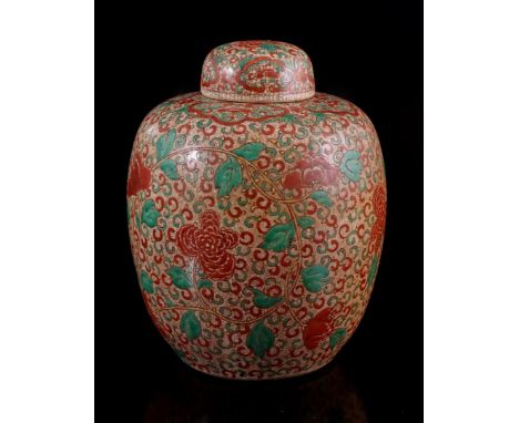 Porcelain lidded jar with red, yellow and green floral decor, Kangxi marked, China 19th century, 34 cm high (lid restored)