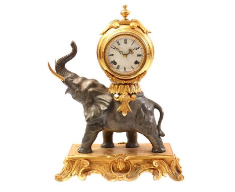 Gold-coloured brass mantel clock worn by an elephant in Louis XV style, 20th century, 43 cm high