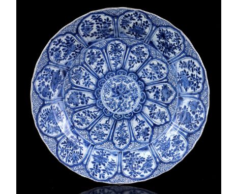 Porcelain dish with blue and white floral decor set in many cartouches, with artemisia leaf at the bottom surrounded by a dou