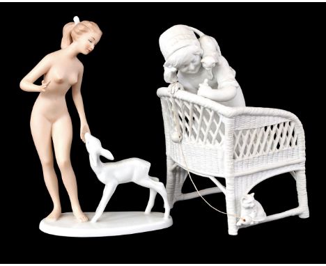 Biscuit porcelain figurine of a girl on a rattan chair playing with a cat, Scheibe Alsbach, 22 cm high and porcelain figurine