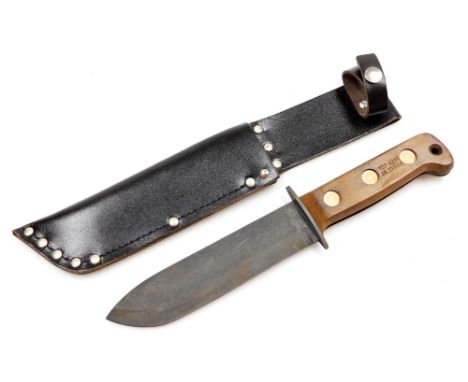 A British Army survival knife 1993, serial number 127 8214, JA 1993/1, with sheath, 33cm wide. 