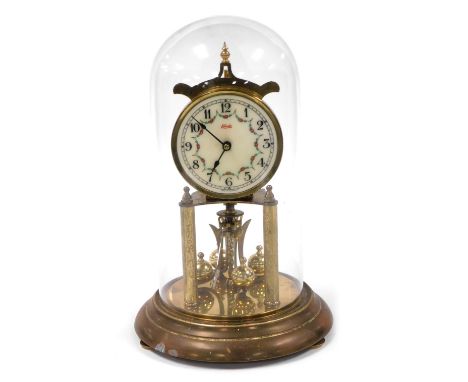 A Kundo brass 400 day anniversary clock, secular enamel dial decorated with floral swags, bearing  Roman numerals, on a metal