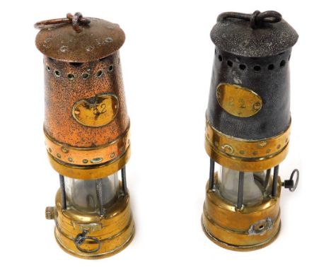 A brass and cast iron miner's safety lamp, no. 22, 26cm  high, together with a brass and coppered cast iron miner's safety la