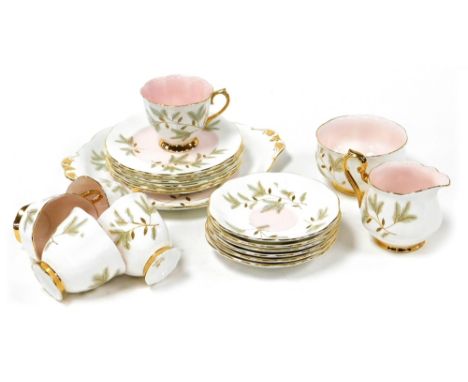 A Royal Albert porcelain part tea service, decorated with pine cones and leaves, comprising bread plate, cream jug, sugar bow