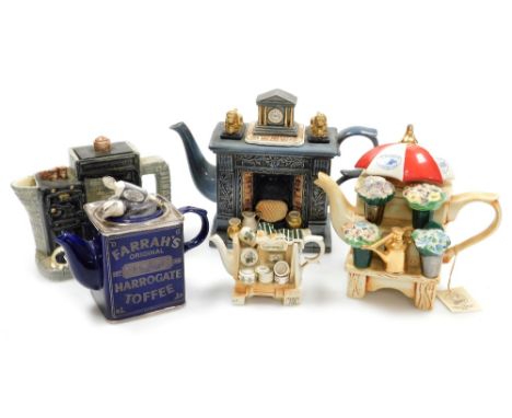 A group of novelty pottery teapots, comprising a Cardew Design Classical Fireplace teapot, limited edition 247/5000, a Border