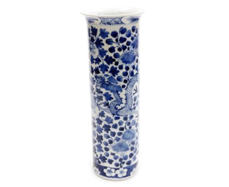A Qing dynasty blue and white porcelain sleeve vase, hand painted with dragons and flowering shrub decoration within a banded