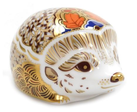 A Royal Crown Derby porcelain Hawthorn Hedgehog paperweight, red printed marks and gold stopper, 10cm wide, boxed.