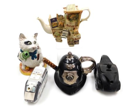 Five novelty pottery teapots, comprising a Saddlers type matt black car, 45cm wide, a Swineside tea pottery teapot in the for