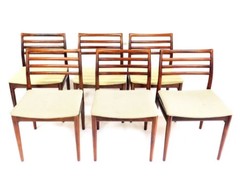 A set of six 1970s Danish rosewood dining chairs by Sorg Stolefabrik, with low raked ladder backs and over upholstered seats 