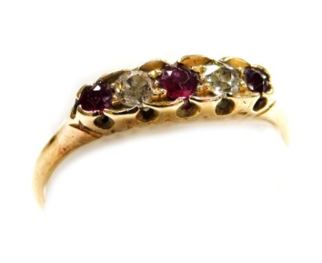 A Victorian gold diamond and ruby five stone ring, the shank internally engraved and dated 1888, size S, 2.3g.