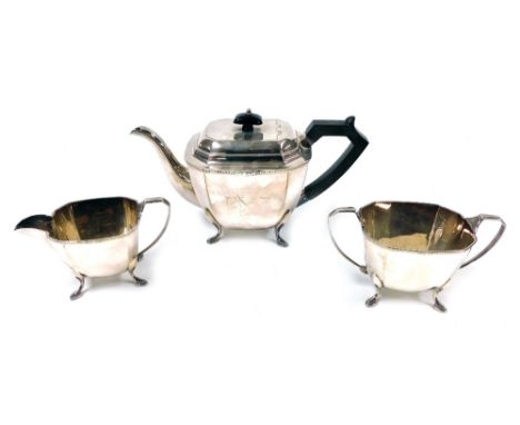 An Art Deco style community plate three piece tea set, comprising teapot, two handled sugar bowl, and milk jug.