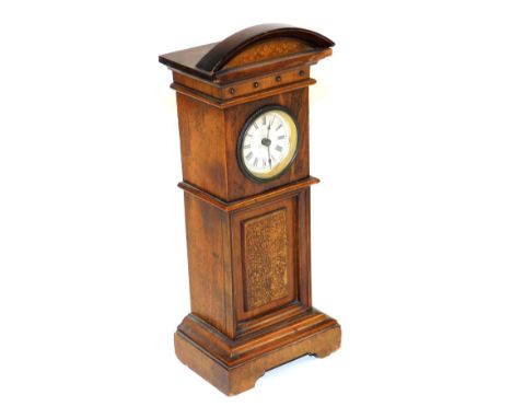 An early 20thC wooden cased miniature longcase clock, circular silvered dial bearing Roman numerals, clockwork movement, the 